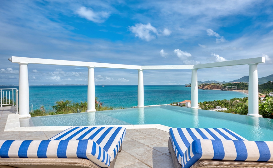 lounge chairs view pool 